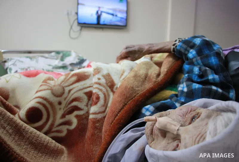 An elderly Palestinian woman sleeps as she receives treatment at El Wafa elderly nursing home, in Gaza city on Feb. 12, 2017. El Wafa elderly nursing home was established in 1980 as one of programs of Al-Wafa Charity Ass...