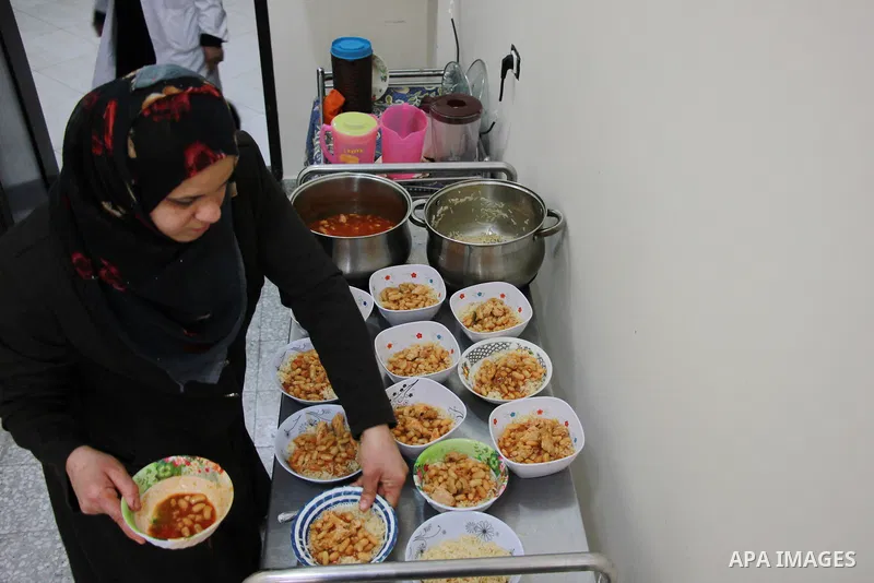 A Palestinian female worker prepares the lunch meal for the elderly at El Wafa elderly nursing home, in Gaza city on Feb. 12, 2017. El Wafa elderly nursing home was established in 1980 as one of programs of Al-Wafa chari...