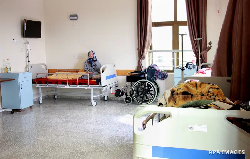 An elderly Palestinian woman prays at El Wafa elderly nursing home, in Gaza city on Feb. 12, 2017. El Wafa elderly nursing home was established in 1980 as one of programs of Al-Wafa charity association. El-Wafa hospital...