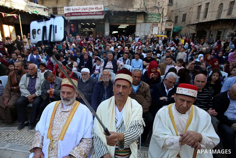 Palestinians Muslim Sufis attend a ceremony commemorating the Islamic holiday of Isra Mi'raj in the West Bank city of Nablus on April 24, 2017. The holiday marks what Muslims believe is Prophet Mohammad's journey from Me...