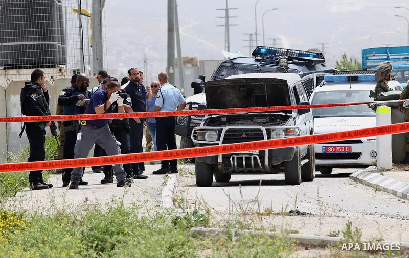 Israeli security forces gather at the site where a Palestinian teenager attempted to stab an Israeli soldier before being shot, at the Hawara checkpoint near the West Bank city of Nablus, on April 26, 2017. A Palestinian...