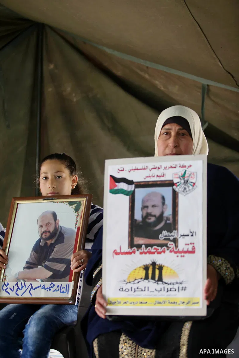 Palestinians take part at a protest tent in support of Palestinian prisoners on hunger strike in Israeli jails, in the West Bank city of Nablus on April 26, 2017. Photo by Ayman Ameen