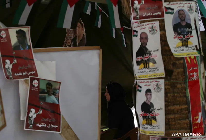 A Palestinian woman takes part at a protest tent in support of Palestinian prisoners on hunger strike in Israeli jails, in the West Bank city of Nablus on April 26, 2017. Photo by Ayman Ameen
