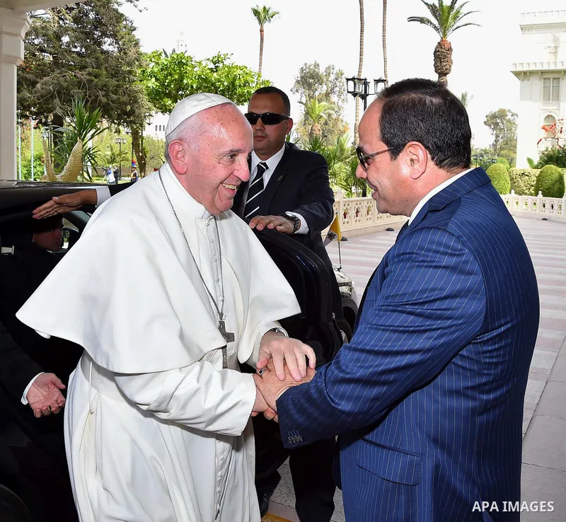 Egyptian President Abdel Fattah al-Sisi greets Pope Francis upon the latter's arrival at the presidential palace in Cairo, during an official visit to Egypt on April 28, 2017. Pope Francis began a visit to Egypt to promo...