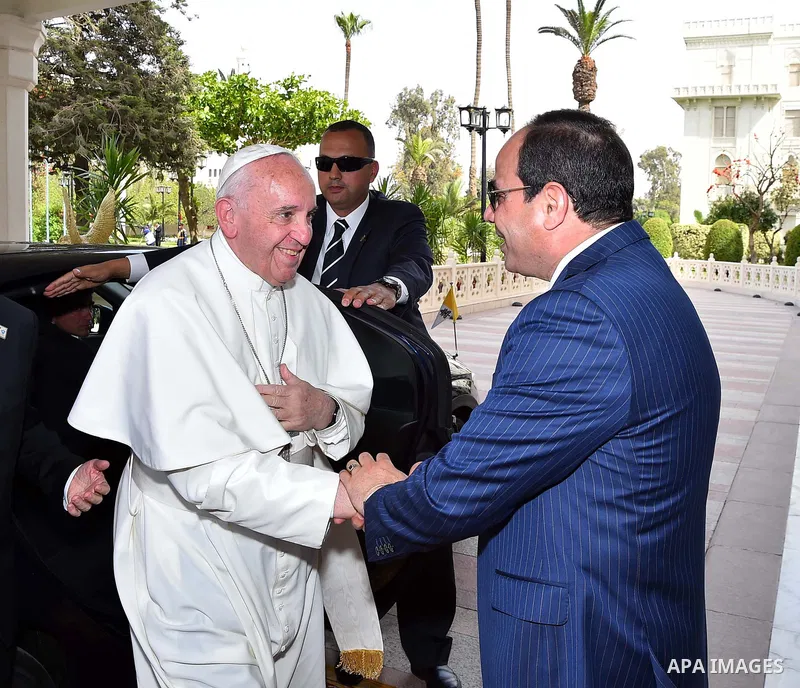Egyptian President Abdel Fattah al-Sisi greets Pope Francis upon the latter's arrival at the presidential palace in Cairo, during an official visit to Egypt on April 28, 2017. Pope Francis began a visit to Egypt to promo...