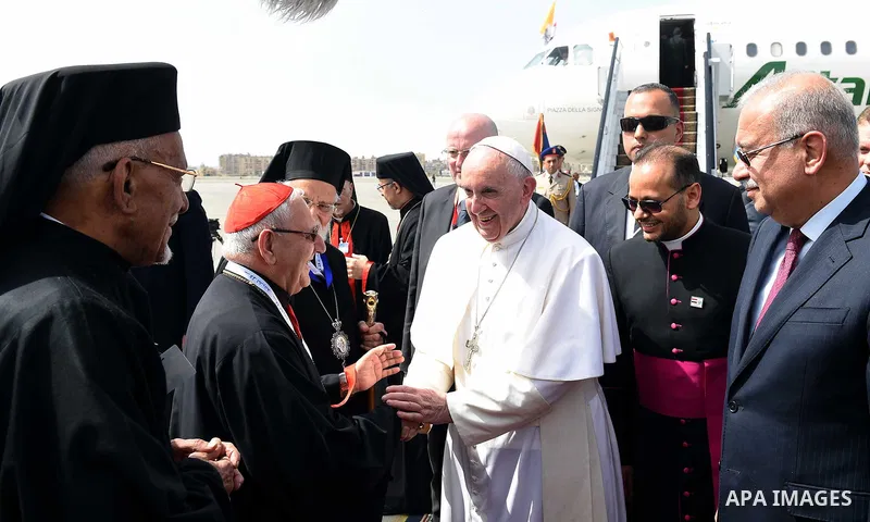 Pope Francis is greeted by officials upon his arrival at Cairo's International Airport on April 28, 2017, during an official visit to Egypt. Pope Francis began a visit to Egypt to promote "unity and fraternity" among Mus...
