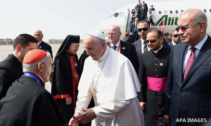 Pope Francis is greeted by officials upon his arrival at Cairo's International Airport on April 28, 2017, during an official visit to Egypt. Pope Francis began a visit to Egypt to promote "unity and fraternity" among Mus...