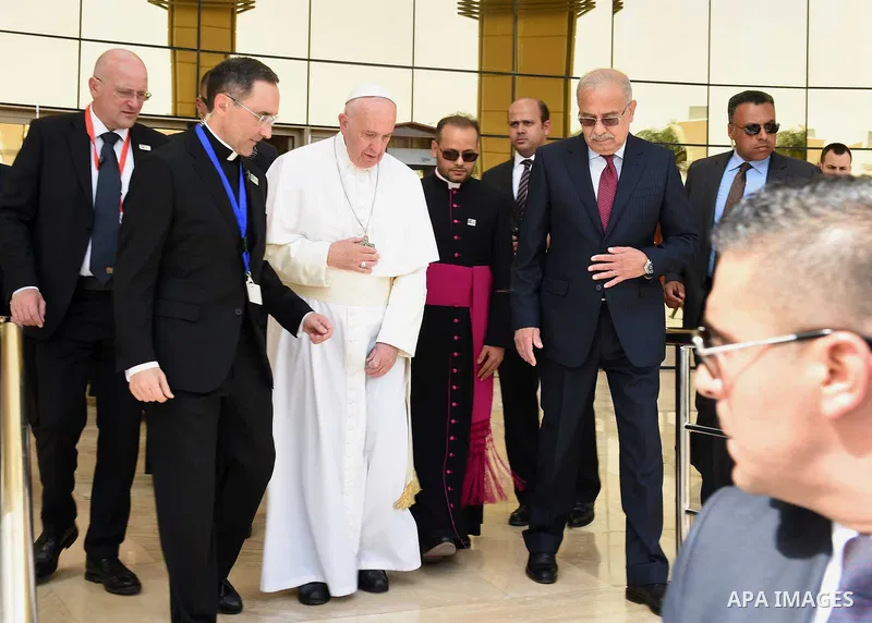 Pope Francis disembarks from his plane upon his arrival at Cairo's International Airport on April 28, 2017, during an official visit to Egypt. Pope Francis began a visit to Egypt to promote "unity and fraternity" among M...
