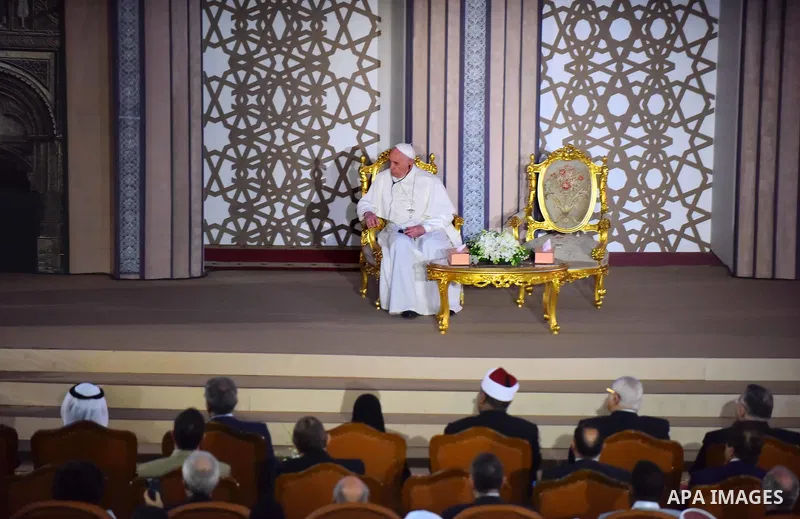 Pope Francis listens as the Grand Imam of Al-Azhar delivers a speech during a visit to the prestigious Sunni institution in Cairo on April 28, 2017. Pope Francis began a visit to Egypt to promote "unity and fraternity" a...