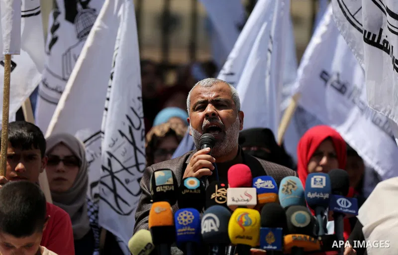 Palestinian supporters of Al-Ahrar movement hold banners during a protest against Palestinian President Mahmoud Abbas and Israeli blockade of the Gaza Strip, in Gaza city, on April 29, 2017. Photo by Ashraf Amra