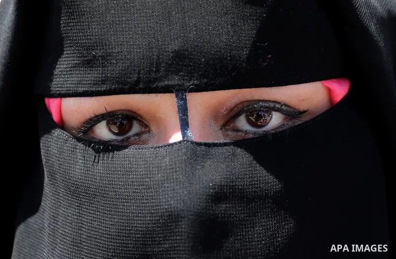 A Palestinian woman poses for a photo during a protest organized by Al-Ahrar movement against Palestinian President Mahmoud Abbas and Israeli blockade of the Gaza Strip, in Gaza city, on April 29, 2017. Photo by Ashraf A...