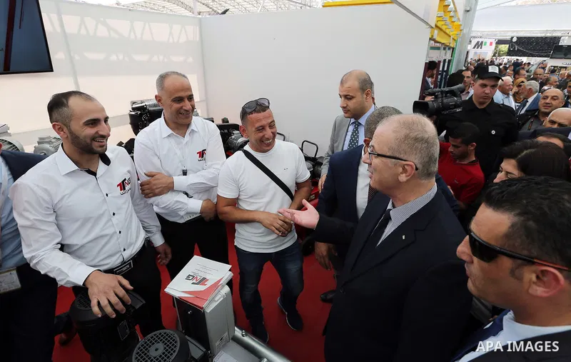 Palestinian Prime Minister Rami Hamdallah takes part in construction industries exhibition, in the West Bank city of Hebron, in April 29, 2017. Photo by Prime Minister Office