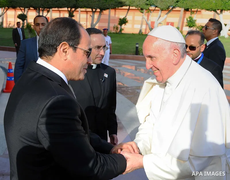Egyptian President Abdel Fattah Sisi bids farewell to Pope Francis at Cairo International Airport in Cairo on April 29, 2017. Pope Francis led a jubilant mass for thousands of Egyptian Catholics during a visit to support...