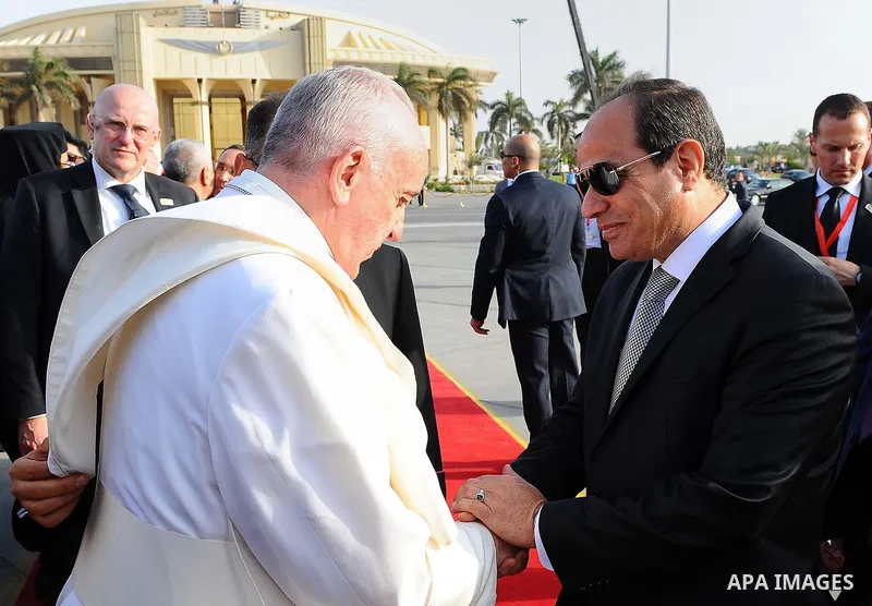 Egyptian President Abdel Fattah Sisi bids farewell to Pope Francis at Cairo International Airport in Cairo on April 29, 2017. Pope Francis led a jubilant mass for thousands of Egyptian Catholics during a visit to support...
