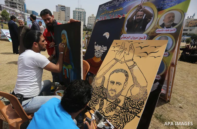 Palestinians take part in a protest to show solidarity with Palestinian prisoners on hunger strike in Israeli jails, in Gaza city on April 30, 2017. Photo by Mohammed Asad