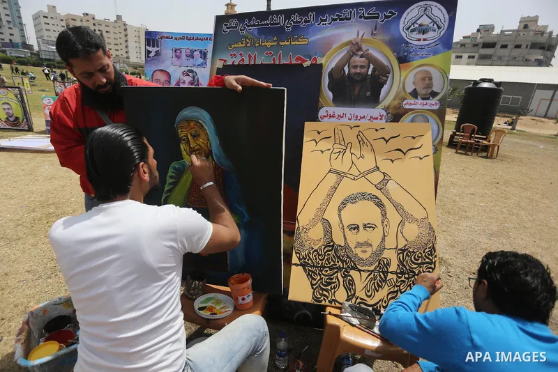 Palestinians take part in a protest to show solidarity with Palestinian prisoners on hunger strike in Israeli jails, in Gaza city on April 30, 2017. Photo by Mohammed Asad