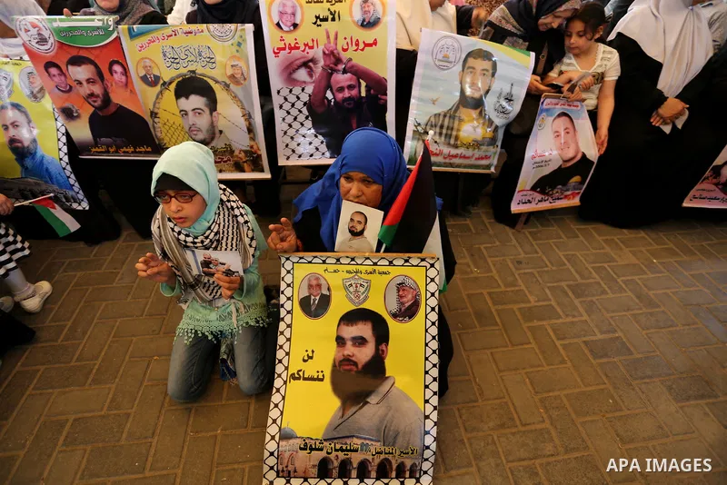 Palestinians take part in a protest to show solidarity with Palestinian prisoners on hunger strike in Israeli jails, in front of Red cross office in Gaza city on May 1, 2017. As more than 1,000 Palestinian prisoners ente...