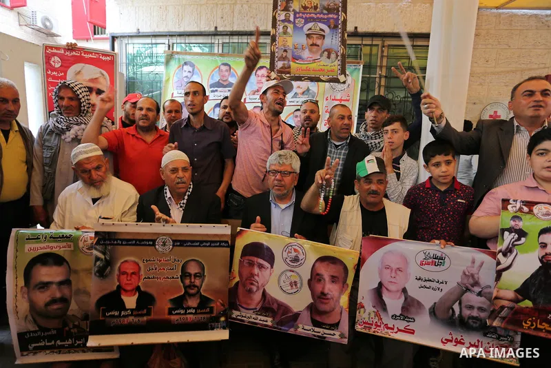 Palestinians take part in a protest to show solidarity with Palestinian prisoners on hunger strike in Israeli jails, in front of Red cross office in Gaza city on May 1, 2017. As more than 1,000 Palestinian prisoners ente...