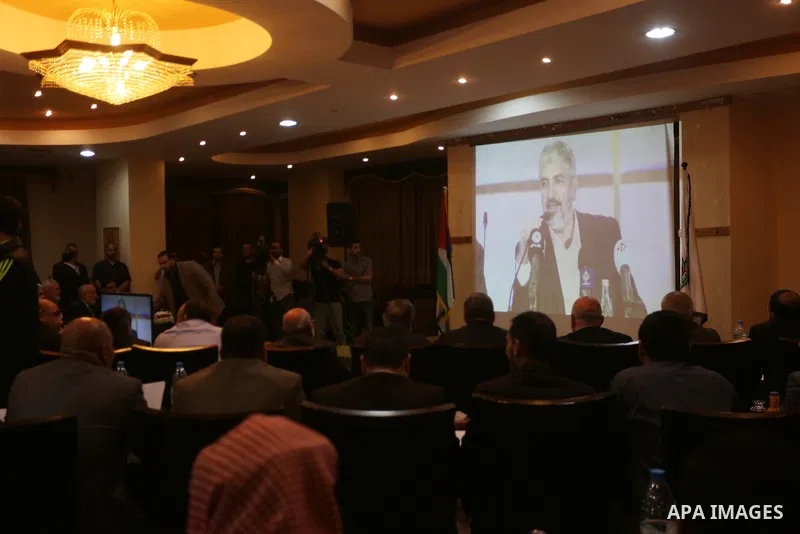 Hamas chief Khaled Mashaal, speaks via video conference during a meeting to announce Hamas political document (the document of general principles and policies), in Gaza city on May 01, 2017. Photo by Mohammed Asad
