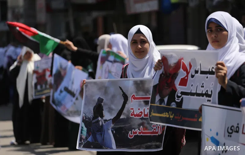 Palestinians take part in a protest against the blockade on Gaza, in the central Gaza Strip May 2, 2017. Photo by Mohammed Asad