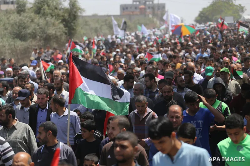 Palestinians take part in a protest against the blockade on Gaza, in the central Gaza Strip May 2, 2017. Photo by Mohammed Asad