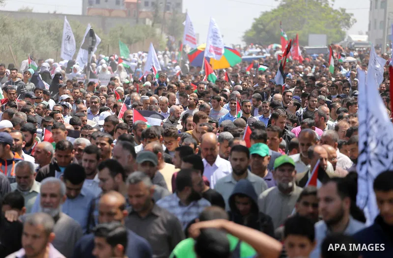 Palestinians take part in a protest against the blockade on Gaza, in the central Gaza Strip May 2, 2017. Photo by Mohammed Asad