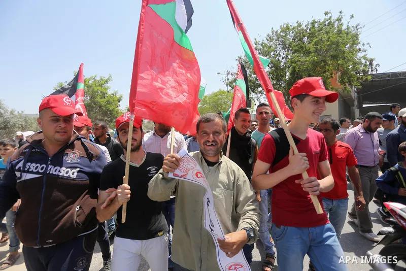 Palestinians take part in a protest against the blockade on Gaza, in the central Gaza Strip May 2, 2017. Photo by Mohammed Asad