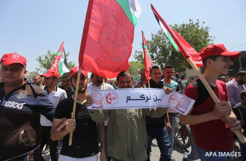 Palestinians take part in a protest against the blockade on Gaza, in the central Gaza Strip May 2, 2017. Photo by Mohammed Asad