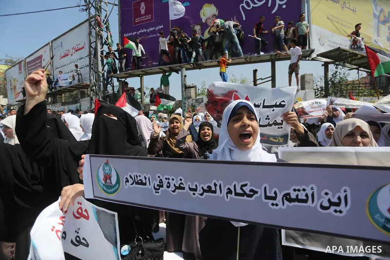 Palestinians take part in a protest against the blockade on Gaza, in the central Gaza Strip May 2, 2017. Photo by Mohammed Asad