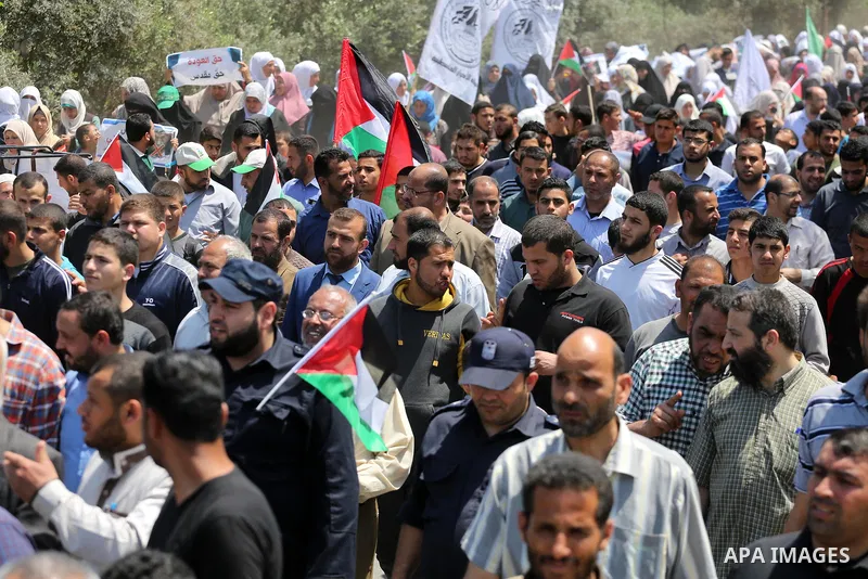 Palestinians take part in a protest against the blockade on Gaza, in the central Gaza Strip May 2, 2017. Photo by Mohammed Asad