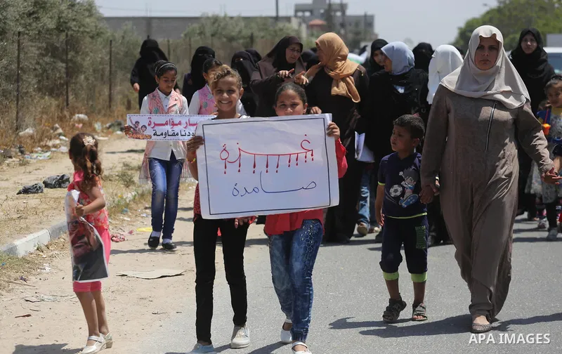Palestinians take part in a protest against the blockade on Gaza, in the central Gaza Strip May 2, 2017. Photo by Mohammed Asad