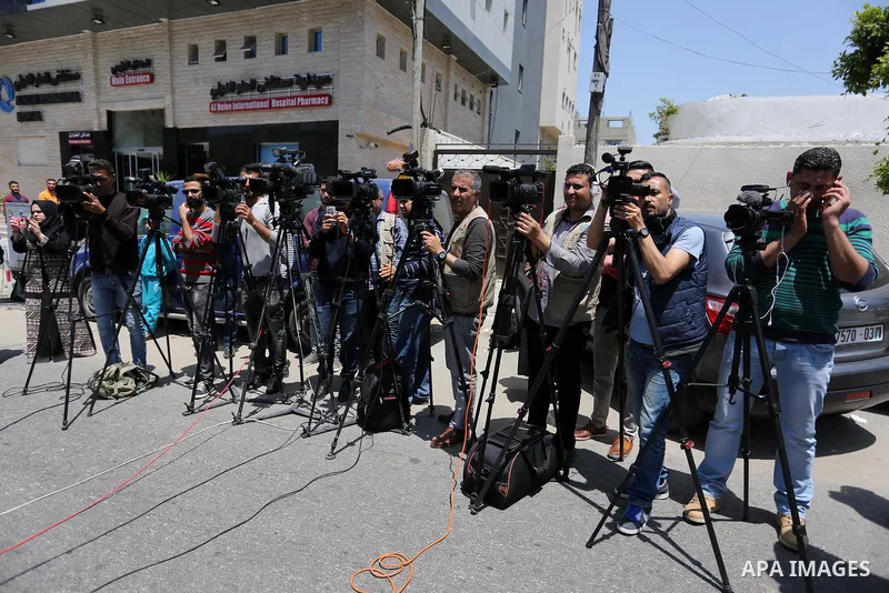Palestinian TV cameramen take video during a protest calling for stop the Israeli violence against journalists on the occasion of World Press Freedom day in front of the high commissioner for human rights headquarters, i...