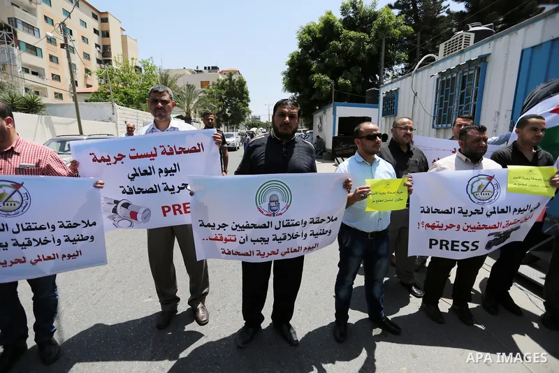 Palestinian Journalists hold banners during a protest calling for stop the Israeli violence against journalists on the occasion of World Press Freedom day in front of the high commissioner for human rights headquarters,...