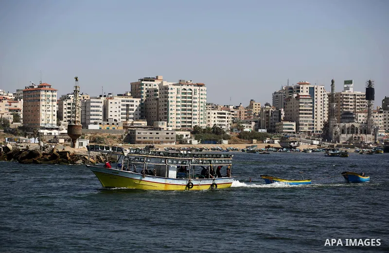 Palestinian fishermen ride their fishing boat at the beach of Gaza City, on May 03, 2017. Israel has eased restrictions on Gaza fishermen, allowing them to travel up to nine nautical miles off the coast of the blockaded...