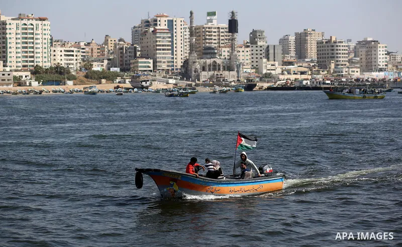 Palestinian fishermen ride their fishing boat at the beach of Gaza City, on May 03, 2017. Israel has eased restrictions on Gaza fishermen, allowing them to travel up to nine nautical miles off the coast of the blockaded...
