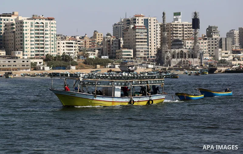 Palestinian fishermen ride their fishing boat at the beach of Gaza City, on May 03, 2017. Israel has eased restrictions on Gaza fishermen, allowing them to travel up to nine nautical miles off the coast of the blockaded...