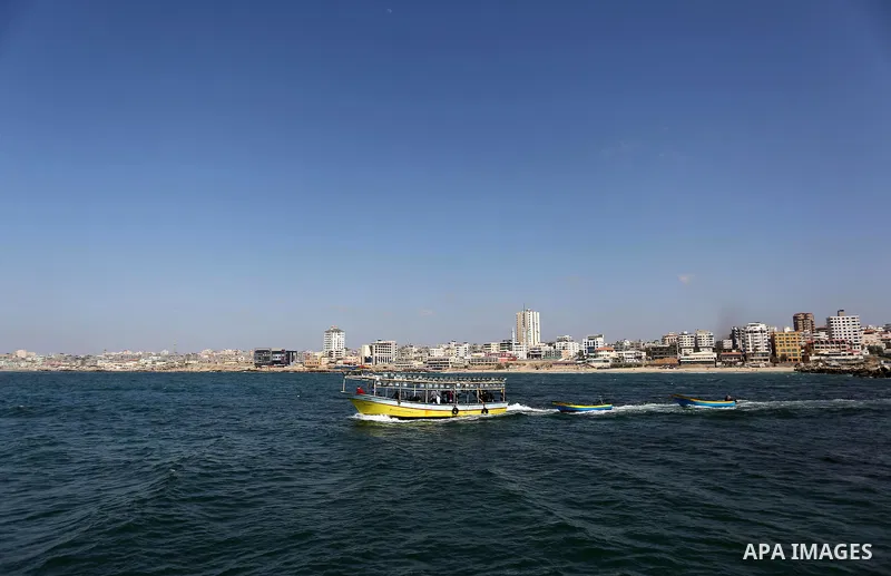 Palestinian fishermen ride their fishing boat at the beach of Gaza City, on May 03, 2017. Israel has eased restrictions on Gaza fishermen, allowing them to travel up to nine nautical miles off the coast of the blockaded...