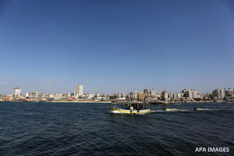 Palestinian fishermen ride their fishing boat at the beach of Gaza City, on May 03, 2017. Israel has eased restrictions on Gaza fishermen, allowing them to travel up to nine nautical miles off the coast of the blockaded...