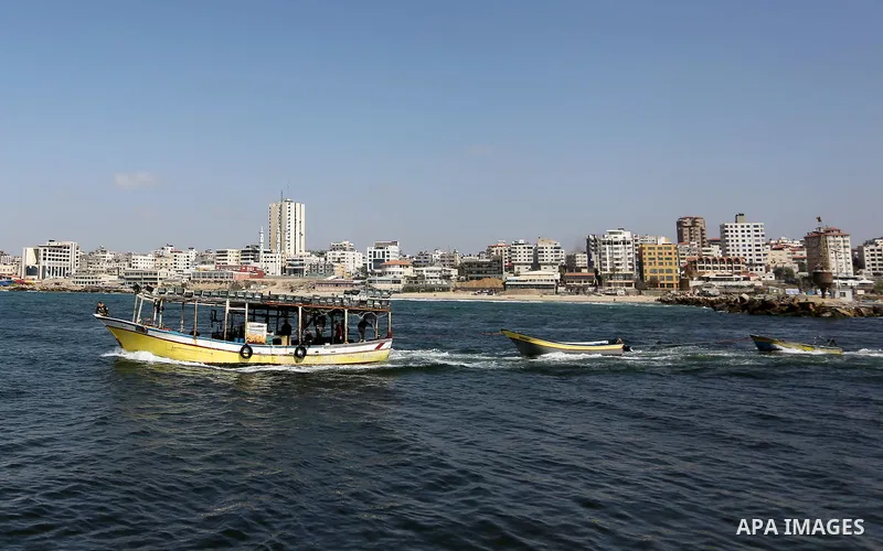 Palestinian fishermen ride their fishing boat at the beach of Gaza City, on May 03, 2017. Israel has eased restrictions on Gaza fishermen, allowing them to travel up to nine nautical miles off the coast of the blockaded...