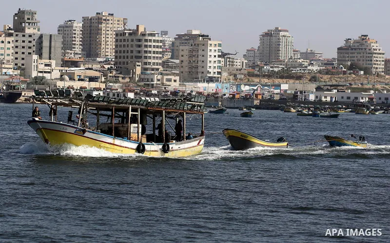 Palestinian fishermen ride their fishing boat at the beach of Gaza City, on May 03, 2017. Israel has eased restrictions on Gaza fishermen, allowing them to travel up to nine nautical miles off the coast of the blockaded...