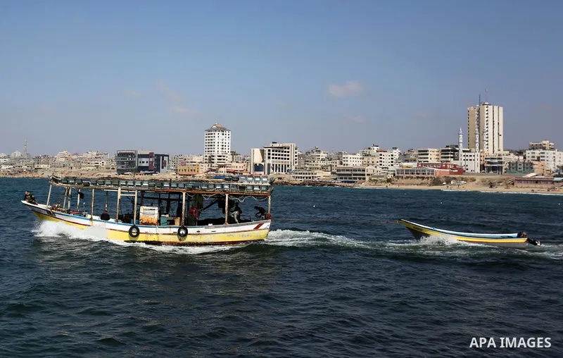Palestinian fishermen ride their fishing boat at the beach of Gaza City, on May 03, 2017. Israel has eased restrictions on Gaza fishermen, allowing them to travel up to nine nautical miles off the coast of the blockaded...