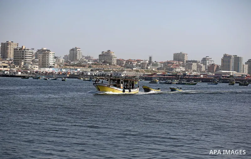 Palestinian fishermen ride their fishing boat at the beach of Gaza City, on May 03, 2017. Israel has eased restrictions on Gaza fishermen, allowing them to travel up to nine nautical miles off the coast of the blockaded...