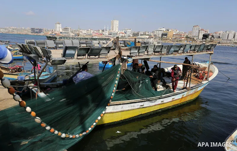 Palestinian fishermen pull their net at the beach of Gaza City, on May 03, 2017. Israel has eased restrictions on Gaza fishermen, allowing them to travel up to nine nautical miles off the coast of the blockaded territory...