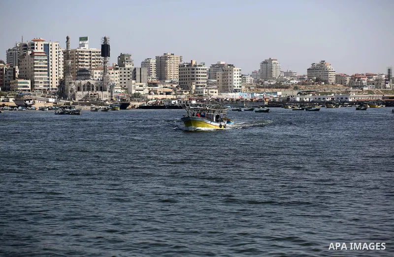 Palestinian fishermen ride their fishing boat at the beach of Gaza City, on May 03, 2017. Israel has eased restrictions on Gaza fishermen, allowing them to travel up to nine nautical miles off the coast of the blockaded...