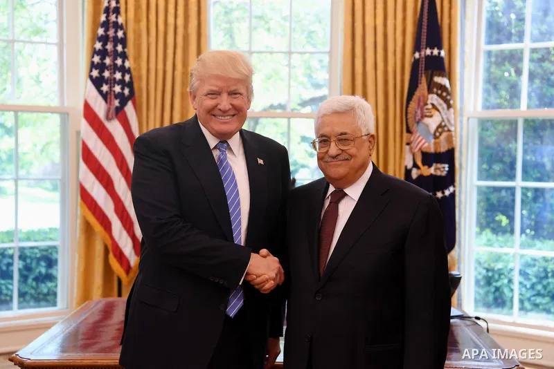 US President Donald Trump shakes hands with Palestinian President Mahmoud Abbas during a meeting in the Oval Office of the White House on May 3, 2017 in Washington, DC. Photo by Thaer Ganaim
