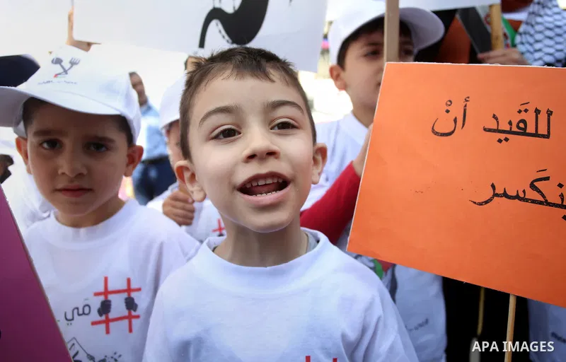 Palestinian children take part in a protest to show solidarity with Palestinian prisoners on hunger strike in Israeli jails, in the West Bank city of Nablus, on May 4, 2017. Photo by Ayman Ameen