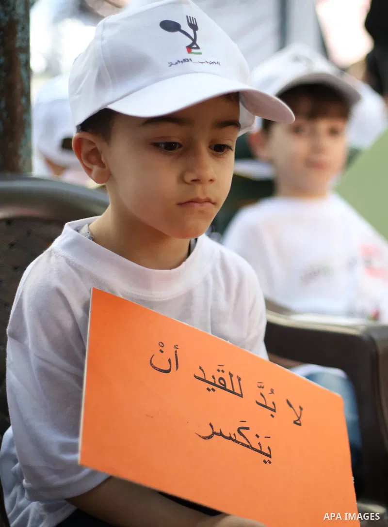 Palestinian children take part in a protest to show solidarity with Palestinian prisoners on hunger strike in Israeli jails, in the West Bank city of Nablus, on May 4, 2017. Photo by Ayman Ameen