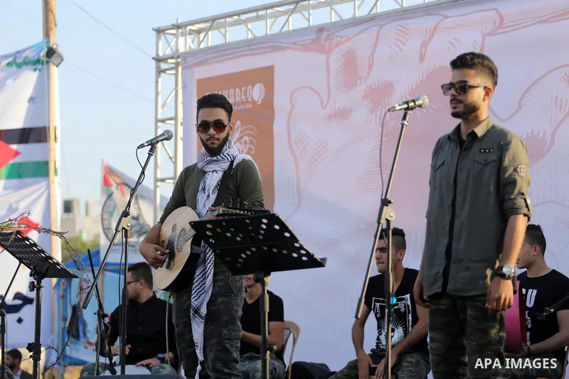 Musicians perform during a concert held in solidarity with Palestinian hunger-striking prisoners in Israeli jails, in Gaza City on May 4, 2017. Photo by Mohammed Asad