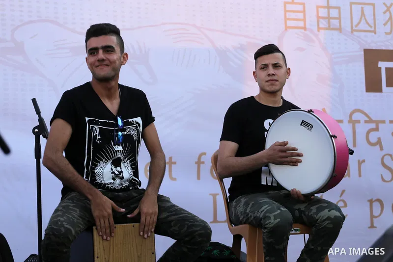 Musicians perform during a concert held in solidarity with Palestinian hunger-striking prisoners in Israeli jails, in Gaza City on May 4, 2017. Photo by Mohammed Asad