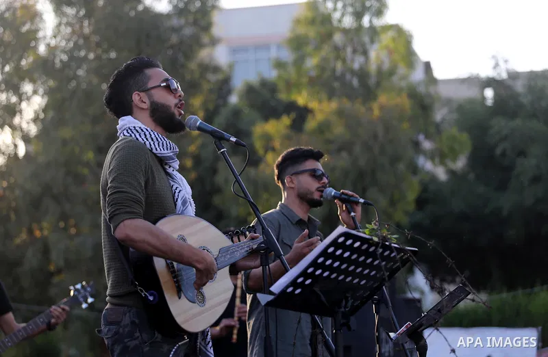 Musicians perform during a concert held in solidarity with Palestinian hunger-striking prisoners in Israeli jails, in Gaza City on May 4, 2017. Photo by Mohammed Asad